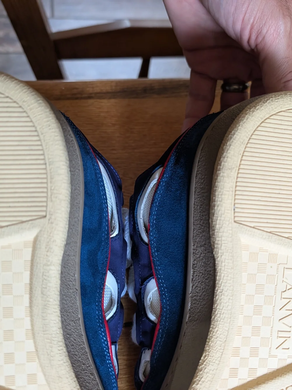 Lanvin Curb Sneakers in a distinct Navy Blue, White, Red, and Yellow colorway.